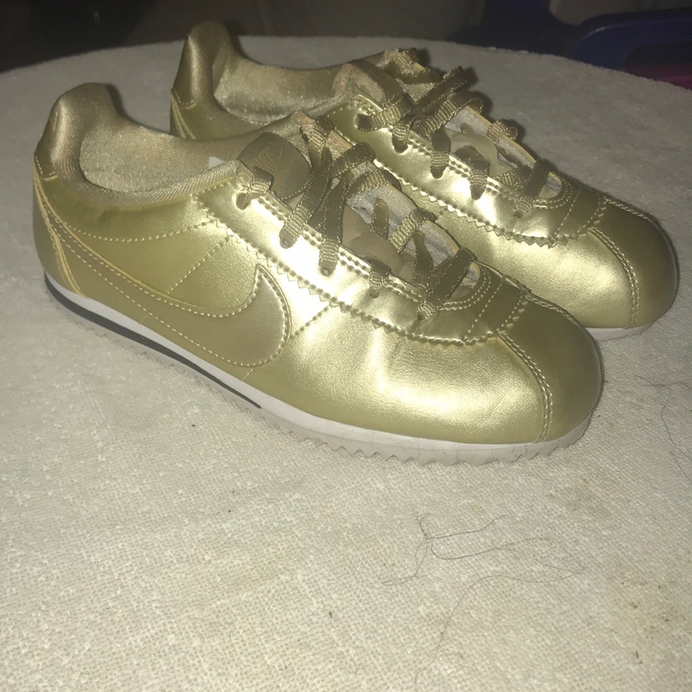 Nike (metallic gold low tops)